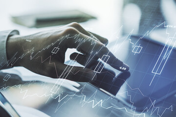Double exposure of abstract creative financial chart with finger clicks on a digital tablet on background, research and strategy concept