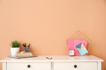 Stylish workplace near color wall