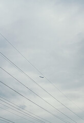 Fototapeta na wymiar plane in the sky over a residential building