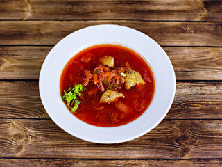 Borscht with greens on the table