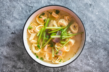 plant-based food, vegan ravioli pasta with vegetable broth and celeri