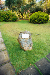 Stone on the Ground with White Blank Tablet.