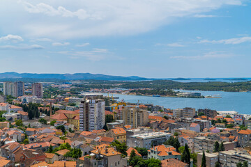 Fototapeta na wymiar Panoramic view with residential socialist towers and medieval houses in Sibenik, Dalmatia, Croatia seen from Barone Fortress