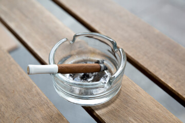 close up cigarette on wooden table