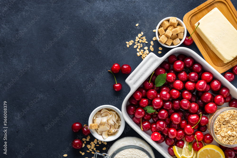 Aufkleber ingredients for cooking pie with cherries on dark background with copy space top view