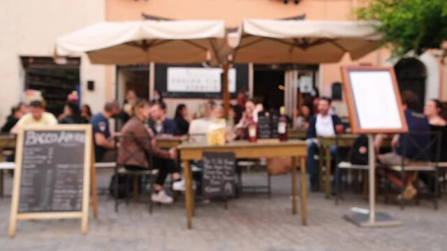 Defocused view of the traditional Italian outdoor cafe in Rome