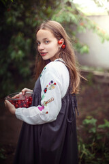 
girl picks cherries in the garden
