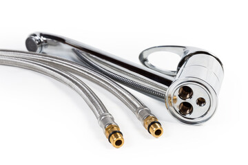 Single handle mixer kitchen tap and supply pipes close-up