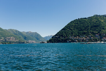 Obraz premium big green mountain surrounded by a lake