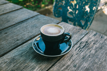 cup of coffee on wooden table
