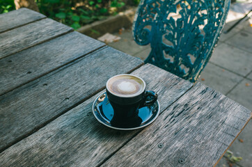 cup of coffee on wooden table