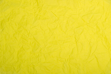 Yellow crumpled paper texture.