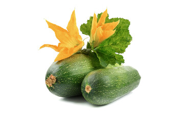 two fresh zucchini with green leaves and a flower isolated on a white background