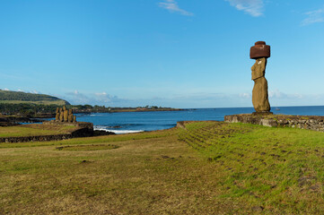 Moai wearing a Pukao (Topknots), Tahai ceremonial complex, Hanga Roa, Rapa Nui National Park,...