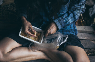 poor people,homeless or beggar begging for help sitting at dirty slum.concept for poverty...