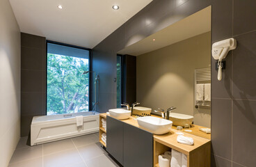 Interior of a luxury hotel bathroom with hydromassage bathtub