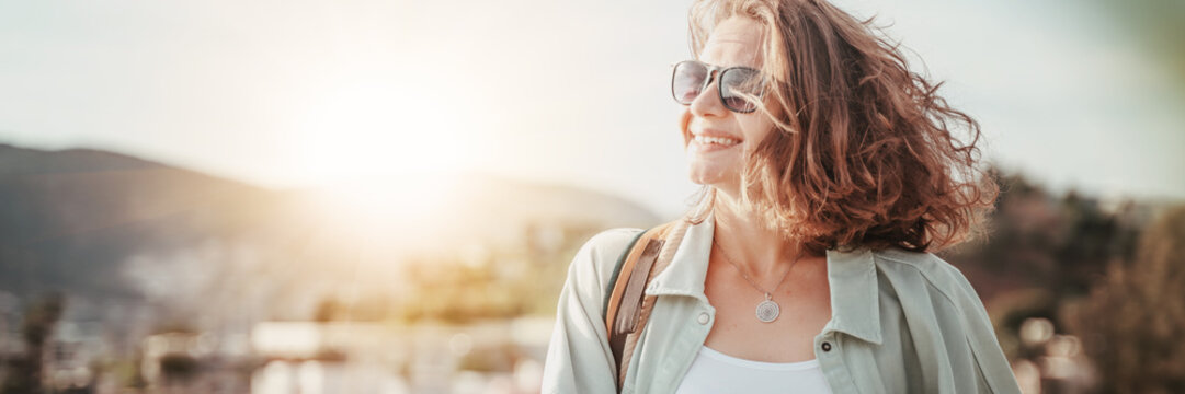 Portrait Of A Beautiful Young Smiling Curly Woman In The Sun Outdoor, Panormama Banner Format