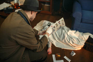Detective with magnifying glass looking letter