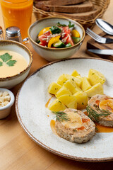 High angle, top view advertisement photo of fully set table in a cafe, wooden table, three course meal