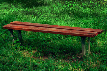 Fototapeta premium Old wooden bench in red