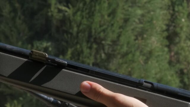 Close-up of hands firing and reloading a rifle.