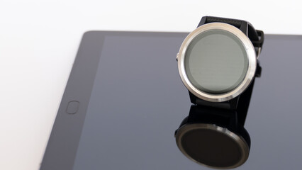 smart round watch isolated on a mirror board