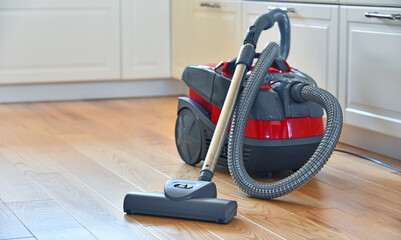 Canister vacuum cleaner for home use on the floor