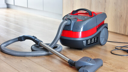 Canister vacuum cleaner for home use on the floor