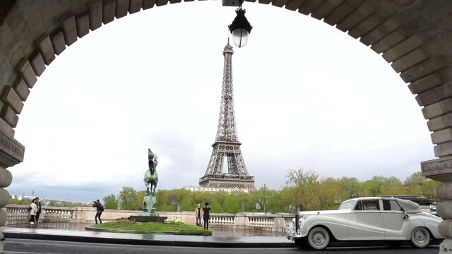 Vintage Wedding car passing the Eiffel Tower, Paris in Slow motion. Stock Video Clip Footage