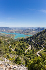Fototapeta na wymiar Winding road and turquoise lake in Grazalema National Park, Spain