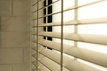 Close-up open venetian blinds. lighting range control sunlight coming from a window. decoration interior. Modern jalousie.