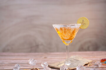 Cocktail on wooden background and space for text 