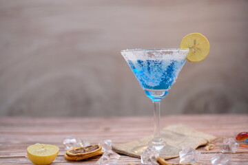 cocktails on wooden table background and space for text 
