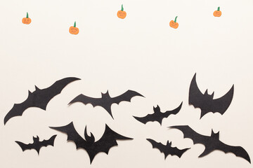 Black bats paper cut background.