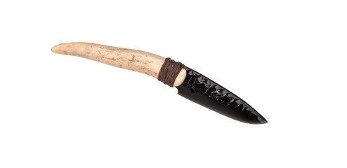 Obsidian knife with bone handle isolate on a white back. Prehistoric weapon made of volcanic glass.