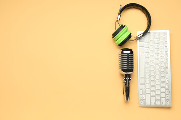 Headphones with microphone and computer keyboard on color background - obrazy, fototapety, plakaty