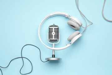 Headphones with microphone on color background