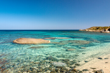 Fototapeta na wymiar crystal clear water and blue sky by the sea in costa rei
