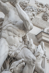 Statue of fight of Hercules with a club and Hydra, serpent like water monster from Classical Greek Mythology, Hofburg Palace, outdoor, Vienna, Austria, details, closeup