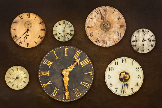 Vintage clocks hanging on an old weathered brown wall
