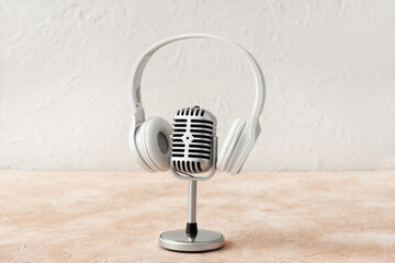 Headphones with microphone on light background