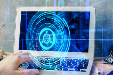 Double exposure of data internet theme hologram with man working on computer on background. Concept...