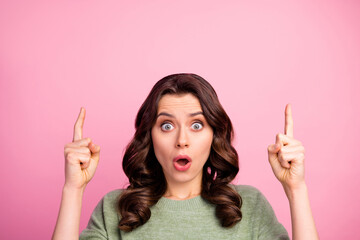 Portrait of astonished girl point index finger copyspace indicate wonderful adverts promotion impressed scream wow omg wear good look jumper isolated over pastel color background