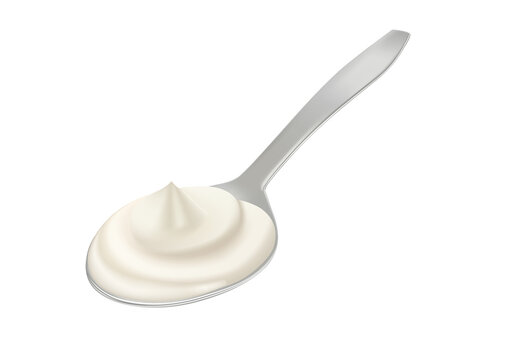White cream in spoon, sour cream, mayonnaise or yogurt, milk sauce, dairy products.