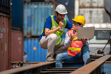 Logistic technician engineer working in cargo logistics site.