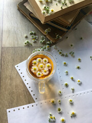 herbal tea with chamomile in a transparent cup