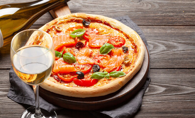 Tasty homemade seafood pizza with salmon