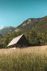 Camping in the nature in the cottage on a meadow below the mountains