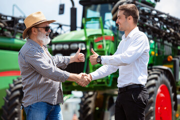 Agreement. Professional farmer with a modern combine in sunlight at work. Confident, bright summer...