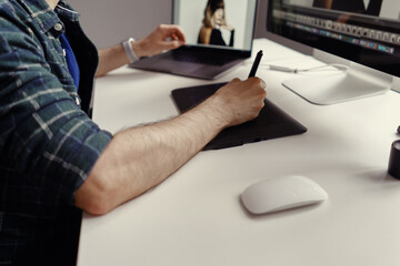 Graphic Designer working hands with interactive pen display, digital Drawing tablet and Pen....